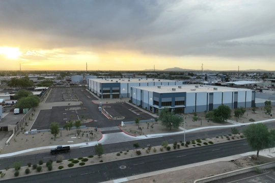 aerial view of industrial building at sunset
